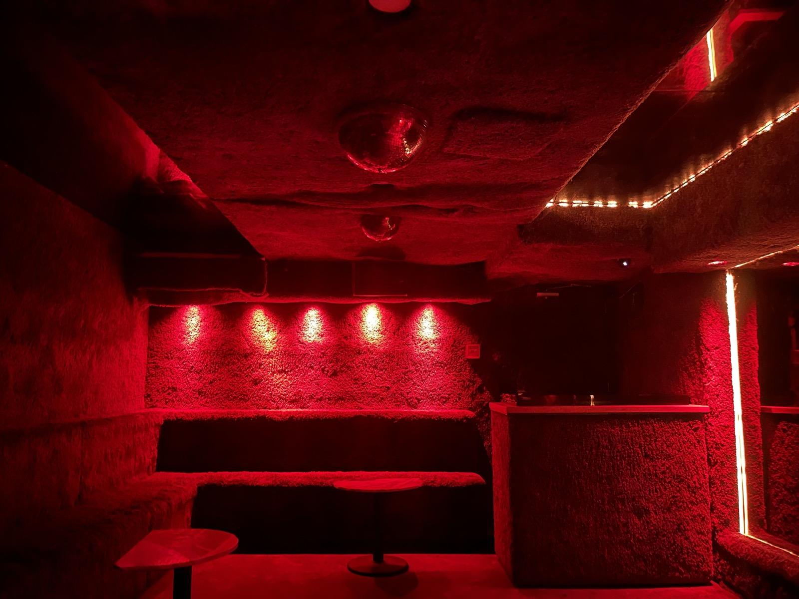 The red lounge with banquette seating